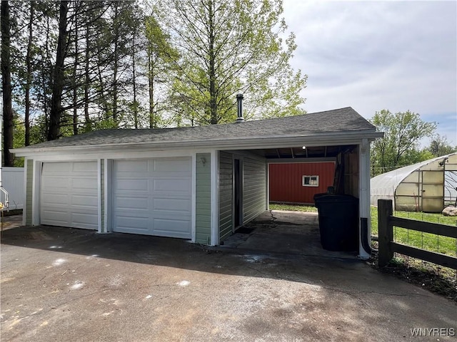 garage with fence