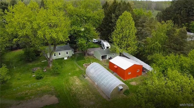 view from above of property with a heavily wooded area