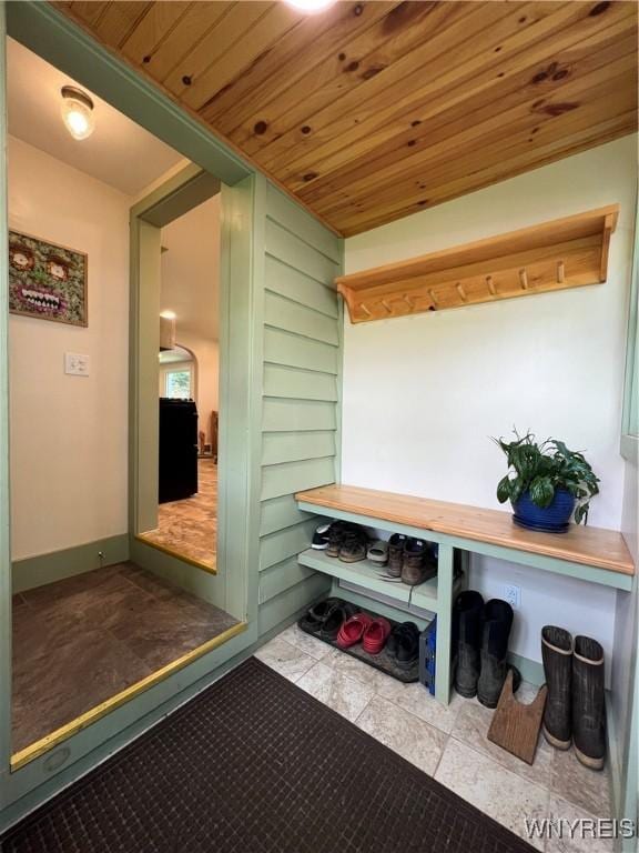 mudroom featuring tile patterned flooring and wood ceiling