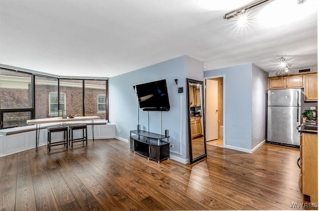 849 Delaware Ave Unit 305, Buffalo, NY 14209 - living area with dark wood-style flooring and baseboards
