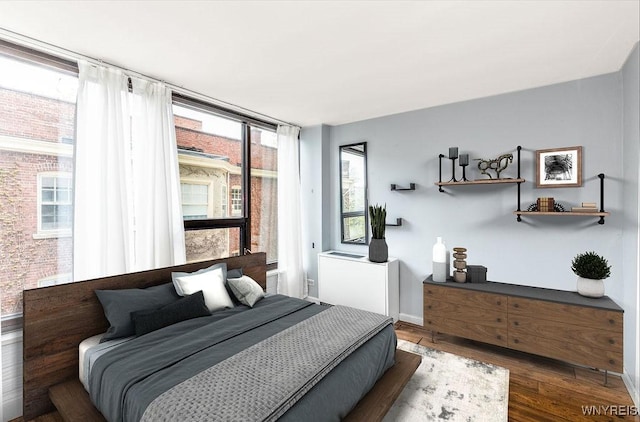 849 Delaware Ave Unit 305, Buffalo, NY 14209 - bedroom featuring wood finished floors and baseboards