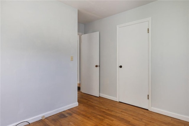 71 Dalrymple Ave, Southport, NY 14871 - unfurnished bedroom with wood finished floors and baseboards