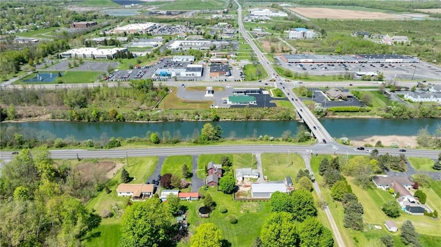 aerial view of property's location featuring a nearby body of water