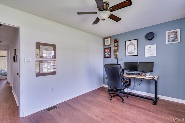 210 Funnycide Dr, Hounsfield, NY 13685 - office space with wood finished floors, ceiling fan, and baseboards