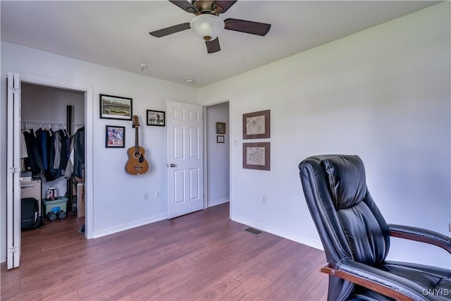210 Funnycide Dr, Hounsfield, NY 13685 - office area featuring wood finished floors, a ceiling fan, and baseboards