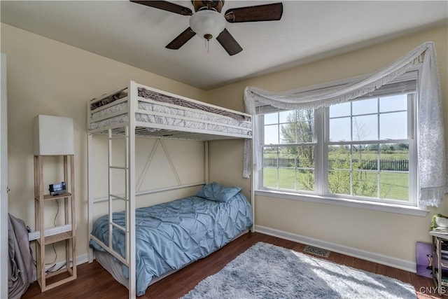 210 Funnycide Dr, Hounsfield, NY 13685 - bedroom with multiple windows, baseboards, and wood finished floors