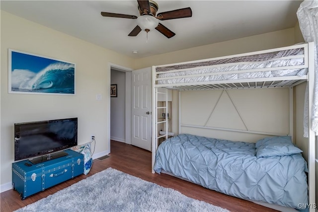 210 Funnycide Dr, Hounsfield, NY 13685 - bedroom with wood finished floors, ceiling fan, and baseboards