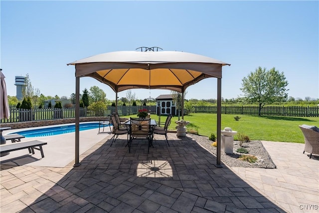 210 Funnycide Dr, Hounsfield, NY 13685 - view of patio with a gazebo, a storage shed, an outdoor structure, and outdoor dining area