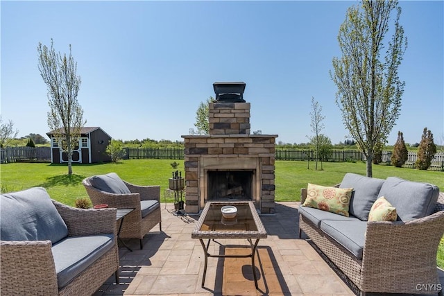210 Funnycide Dr, Hounsfield, NY 13685 - view of patio with an outdoor living space with a fireplace, a storage unit, and an outbuilding