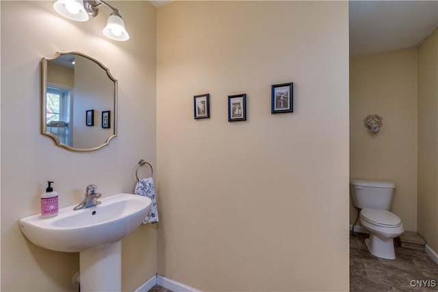210 Funnycide Dr, Hounsfield, NY 13685 - bathroom featuring toilet and baseboards