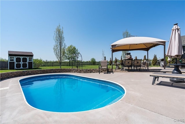 210 Funnycide Dr, Hounsfield, NY 13685 - view of pool with a gazebo, a storage unit, an outdoor structure, a fenced backyard, and a patio area