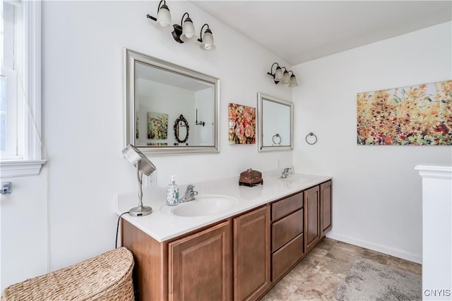 210 Funnycide Dr, Hounsfield, NY 13685 - bathroom featuring baseboards and double vanity