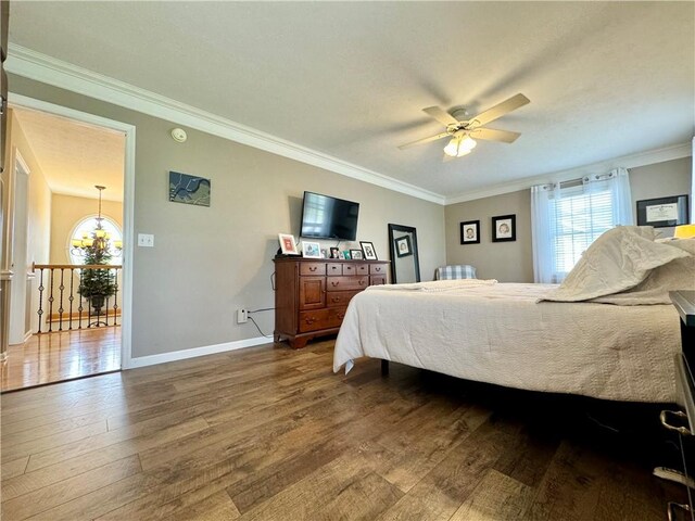 214 Fairfield Dr, Horseheads, NY 14845 - bedroom with wood finished floors, ornamental molding, baseboards, and ceiling fan