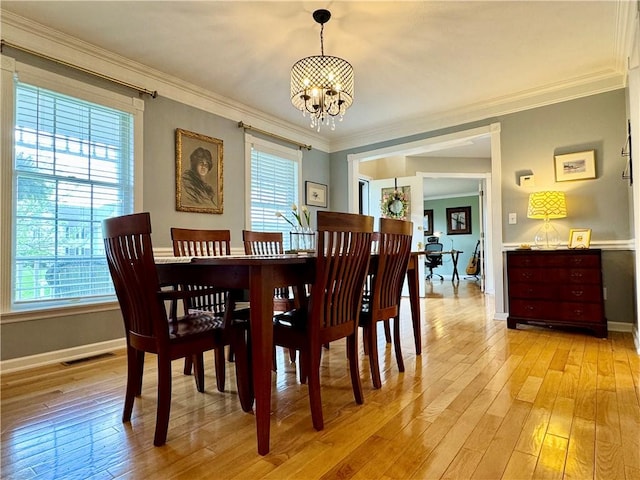 214 Fairfield Dr, Horseheads, NY 14845 - dining area featuring a chandelier, healthy amount of natural light, light wood-style flooring, and crown molding