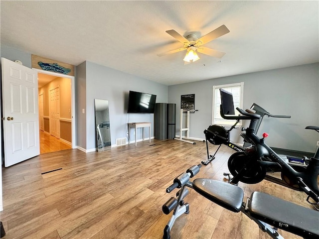 214 Fairfield Dr, Horseheads, NY 14845 - workout area featuring a ceiling fan, light wood-style floors, and baseboards