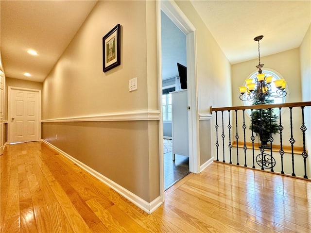 214 Fairfield Dr, Horseheads, NY 14845 - corridor featuring a chandelier, wood-type flooring, baseboards, and recessed lighting