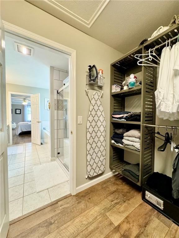 214 Fairfield Dr, Horseheads, NY 14845 - spacious closet with wood finished floors and a ceiling fan