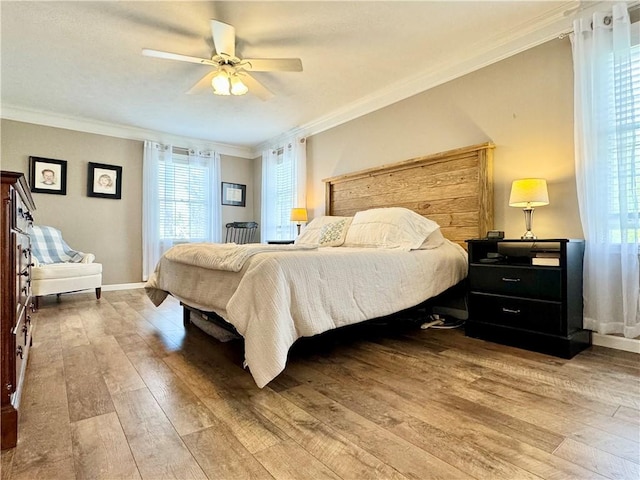 214 Fairfield Dr, Horseheads, NY 14845 - bedroom with light wood finished floors, ornamental molding, baseboards, and ceiling fan