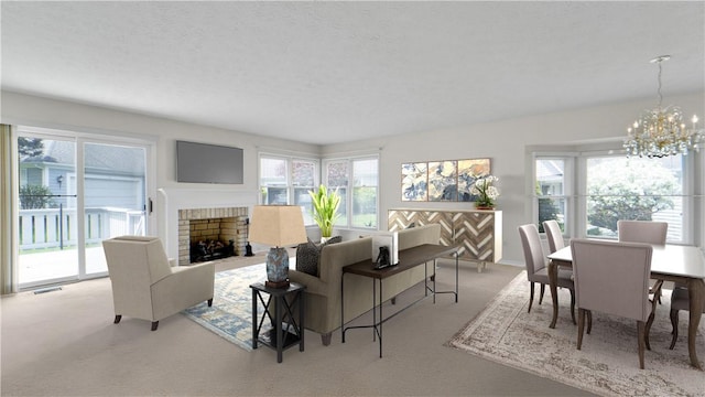 carpeted living room with a chandelier and a fireplace