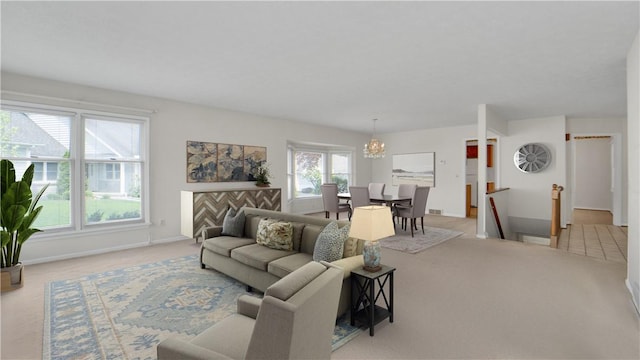 living room featuring light carpet, a chandelier, and baseboards