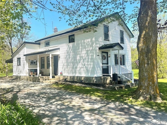 28889 Nys Route 37, Pamelia, NY 13637 - view of front of property with a chimney and covered porch