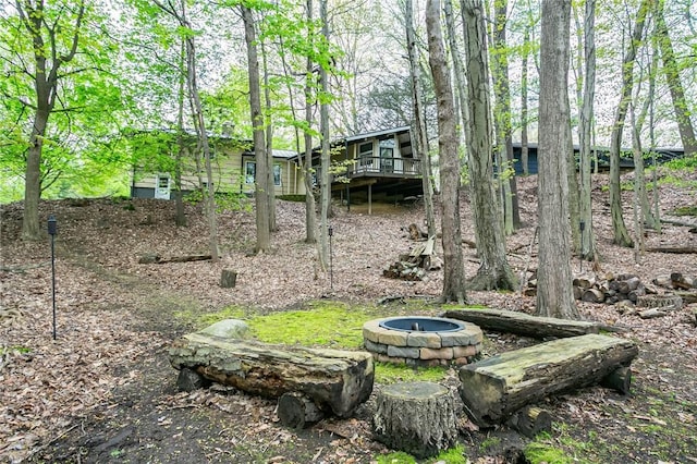 view of yard with a fire pit and a deck