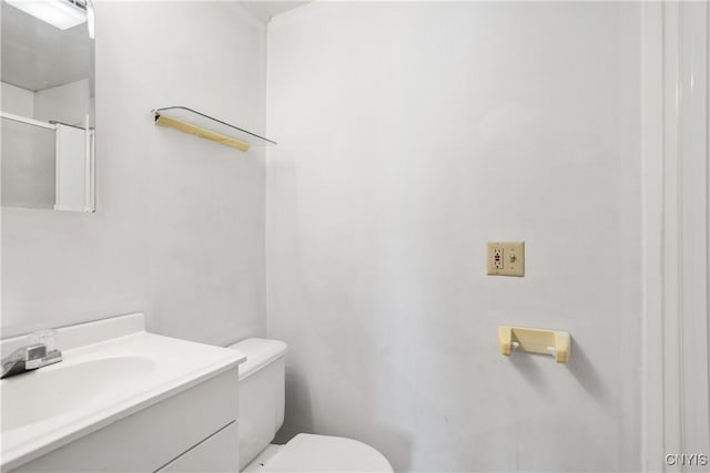 bathroom with toilet and vanity