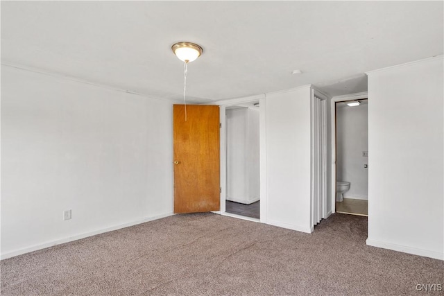 unfurnished bedroom with carpet and baseboards