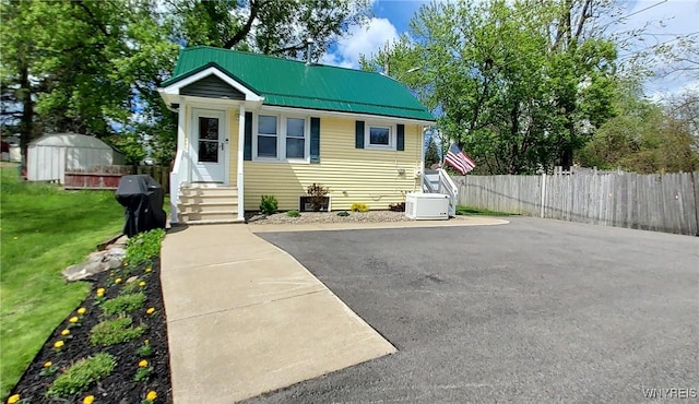 72 Ebenezer Dr Rear, Rear, West Seneca, NY 14224 - view of front facade with entry steps, metal roof, and an outdoor structure