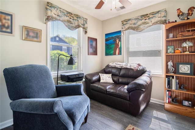 483 Indian Cv, Moravia, NY 13118 - living area with ceiling fan, wood finished floors, and baseboards