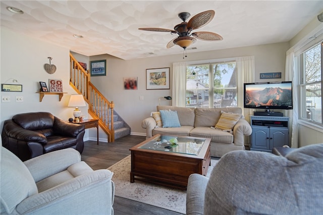 483 Indian Cv, Moravia, NY 13118 - living area featuring stairs, wood finished floors, baseboards, and ceiling fan