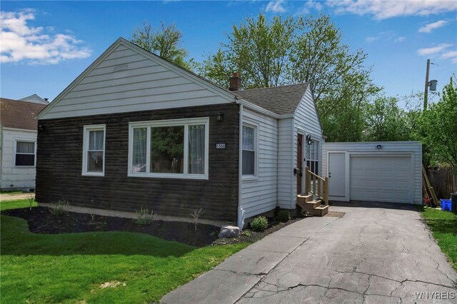 1506 Eggert Rd, Amherst, NY 14226 - view of side of property featuring entry steps, a lawn, driveway, and a chimney