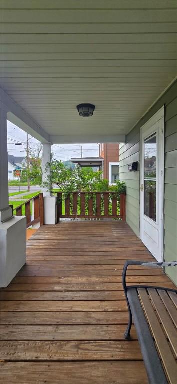 612 Reynolds St, Elmira-City, NY 14904 - wooden deck featuring covered porch