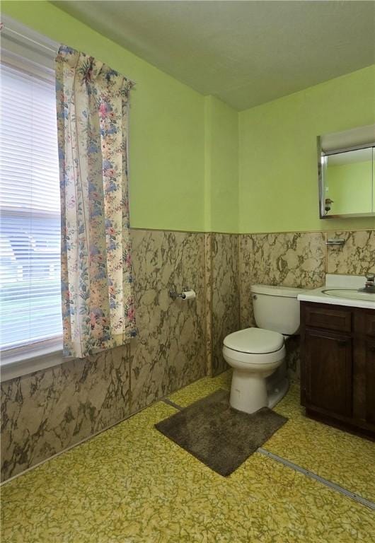 612 Reynolds St, Elmira-City, NY 14904 - bathroom with toilet, a wainscoted wall, and vanity