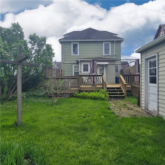 612 Reynolds St, Elmira-City, NY 14904 - back of property featuring a yard and a wooden deck