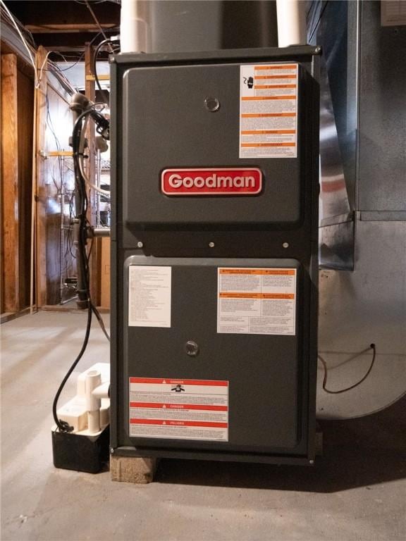 utility room featuring heating unit