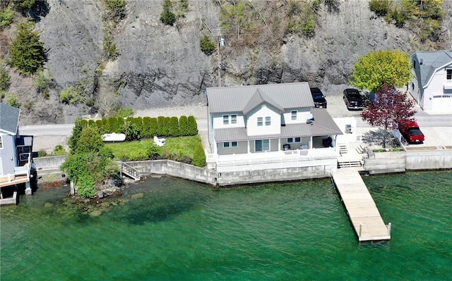 view of subject property with a large body of water