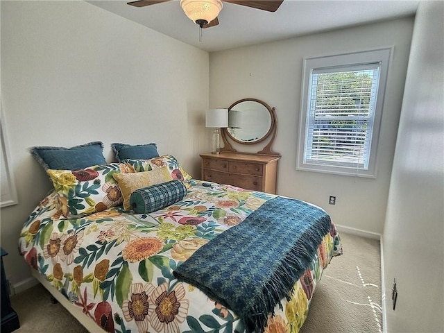 bedroom with carpet floors, baseboards, and a ceiling fan