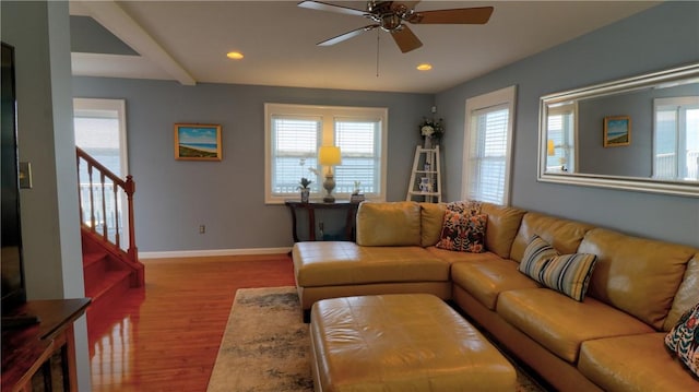 living area featuring ceiling fan, wood finished floors, baseboards, recessed lighting, and stairway
