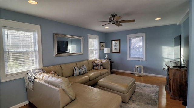 living room featuring ceiling fan, plenty of natural light, wood finished floors, baseboards, and recessed lighting