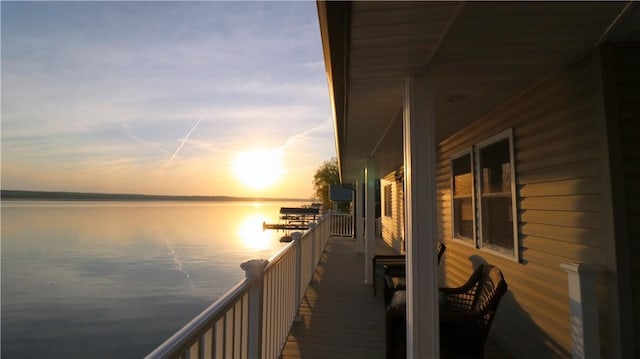dock with a water view and a balcony