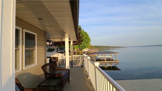 balcony featuring a water view