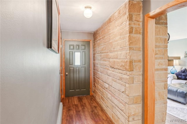 doorway to outside featuring wood finished floors