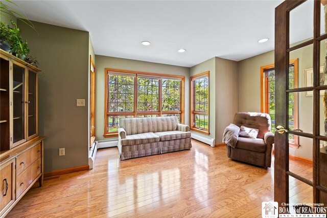 24 Castile Dr, Pomfret, NY 14063 - sitting room with baseboards, light wood-type flooring, a baseboard radiator, and recessed lighting