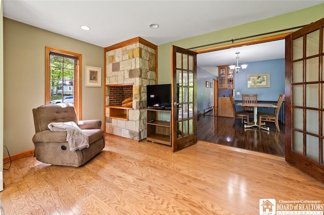 24 Castile Dr, Pomfret, NY 14063 - sitting room featuring wood finished floors, a chandelier, recessed lighting, and baseboards