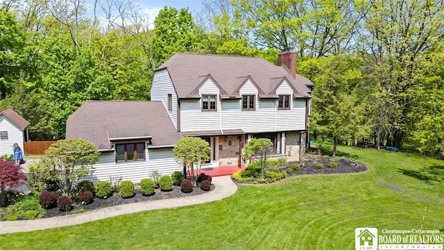 24 Castile Dr, Pomfret, NY 14063 - view of front of house featuring a front lawn and a chimney