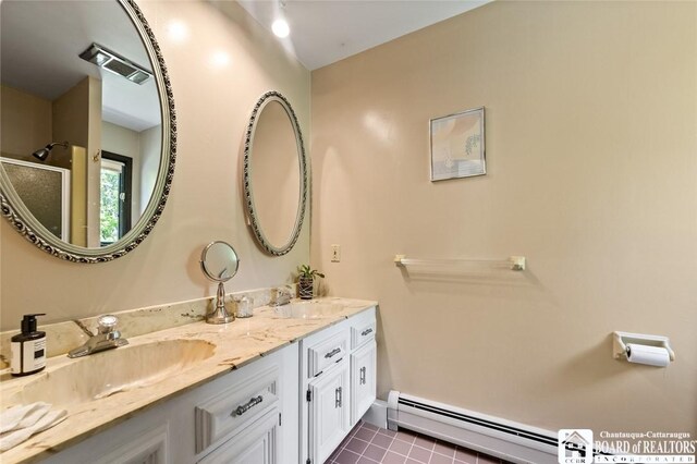 24 Castile Dr, Pomfret, NY 14063 - bathroom with baseboard heating, a shower stall, double vanity, tile patterned floors, and baseboards