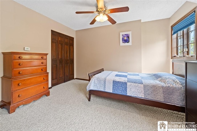 24 Castile Dr, Pomfret, NY 14063 - carpeted bedroom with a closet, a textured ceiling, ceiling fan, and baseboards