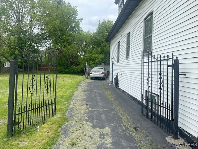 14 Thornton Ave, Buffalo, NY 14215 - view of property exterior with asphalt driveway and a yard