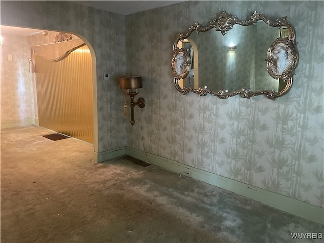 14 Thornton Ave, Buffalo, NY 14215 - interior space with arched walkways, wallpapered walls, and baseboards